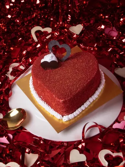 Our 'Lovey Dovey' Mini Cake is a heart-shaped red velvet cake, perfect for showing your affection in the sweetest way possible.