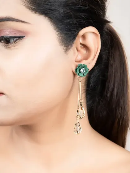 A close-up of a model wearing long, elegant earrings. I focus on capturing the delicate details and craftsmanship of each piece.