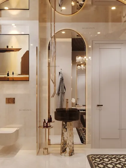 This opulent bathroom and dressing area features a freestanding pedestal sink, gold-trimmed mirrors and wall panels, and a unique patterned floor rug, creating a space of pure luxury.