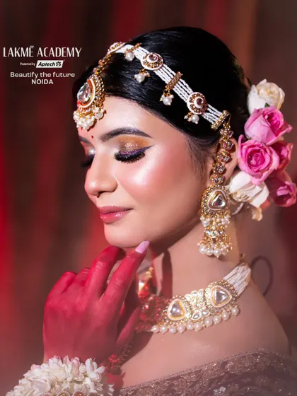 A close-up on the side profile of a contemporary bride. This view emphasizes the flawless eye makeup, the intricate earring design, and the elegant hair styling taught in our courses.