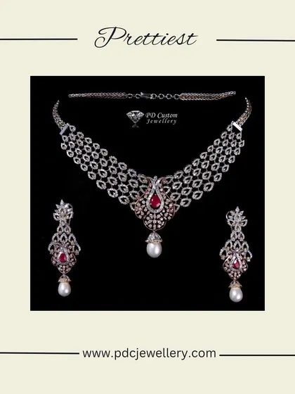 A gorgeous diamond necklace set featuring a three-tiered design with ruby and pearl drops. This piece combines the sparkle of diamonds with a pop of color, making it a beautiful choice for any celebration.