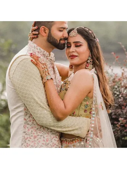 An intimate close-up of the couple embracing during their Haldi shoot.