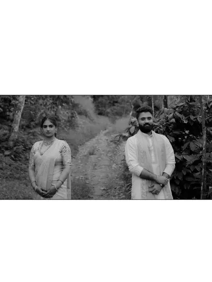 A creative black and white shot of the couple, capturing a quiet and intimate moment.