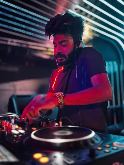 Under the neon lights at Helium Pune, completely focused on the mix. The club environment is where I test new ideas and see firsthand what makes people move.