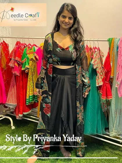 This modern Indo-Western outfit, featuring a drape skirt and a sheer jacket, was created by upcycling an old saree. It’s a perfect example of how we can blend contemporary style with traditional fabrics.