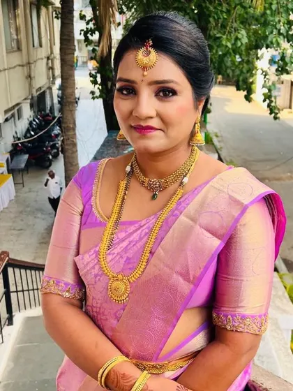 A beautiful, simple makeup look for a daytime event. The client looks effortlessly graceful with a neat hair updo and makeup that enhances her features.
