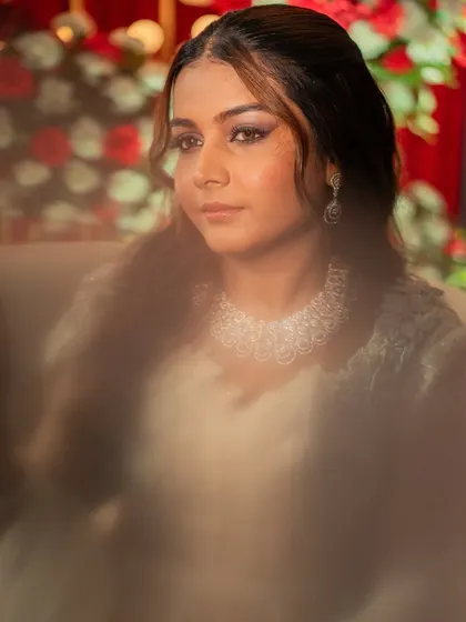 Shikha, stealing the spotlight at her sangeet. This dreamy, soft focus shot highlights her smokey eye makeup and the beautiful details of her all white outfit.