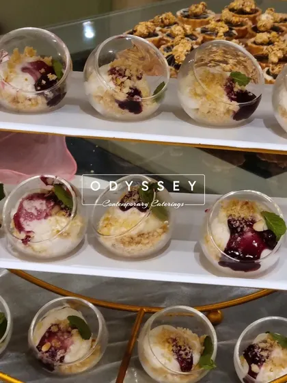 Our blueberry crumble dessert cups, served in unique spherical glasses. The presentation adds a touch of modern elegance to this classic dessert.