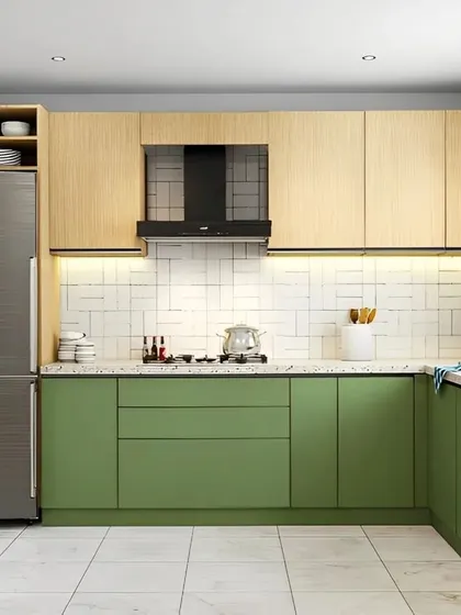 A fresh and modern L-shaped kitchen featuring sage green lower cabinets and light wood uppers. This design combines color with natural textures, creating a bright and welcoming kitchen with plenty of storage and counter space.