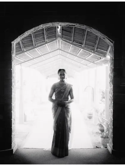 A bride's quiet anticipation. I framed Mohita in this archway, using the dramatic light to create a timeless, fine art bridal portrait that feels both powerful and serene. This is where photography becomes artwork.
