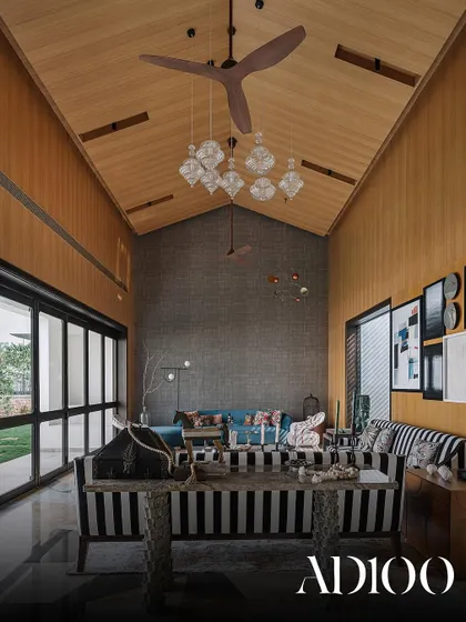 A double-height living space with a pitched wooden ceiling, as seen in our AD100 feature.