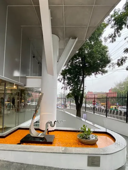Another view of the entrance water feature at MAP, showing the relationship between the sculpture, the tree-like column, and the street.