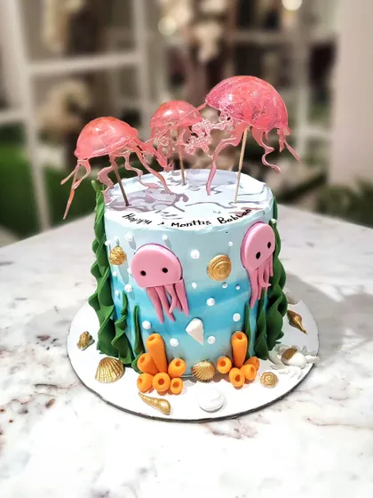 I'm so proud of how these translucent jellyfish toppers turned out. They look like they are floating above this ocean-themed cake, adding a touch of realism and wonder.