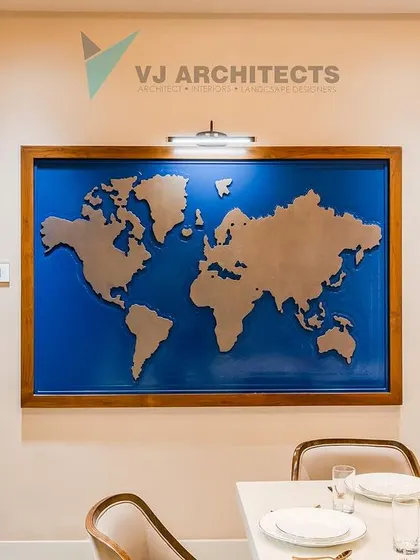 A closer look at the world map feature wall, positioned next to a traditionally carved wooden door frame. This juxtaposition of global modernism and local heritage is central to the home's design story.
