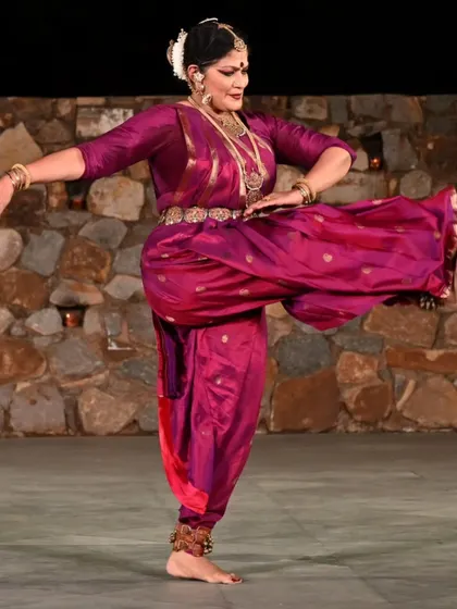 Performing at a heritage site like the Sunder Nagar Nursery amphitheater connects the dance to its roots in a special way. This pose captures the yoga-shakti, the inherent power and grace that is at the core of every Bharatanatyam movement. The costume and temple jewelry complete the visual poetry.