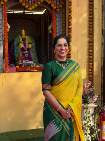 Madhurani at a temple, in character for the promotional shoot. The look is simple and traditional, fitting for the historical figure she portrays.