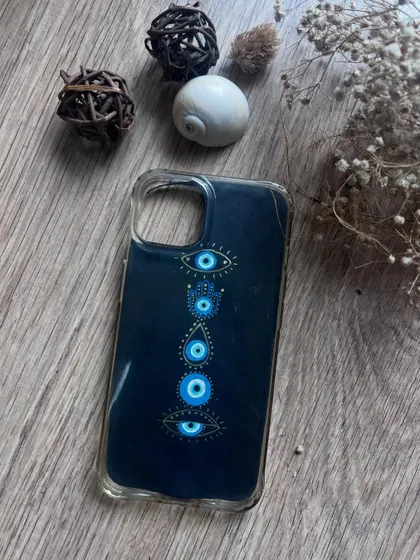 An Evil Eye and Hamsa hand design for a phone case, offering spiritual protection on the go.