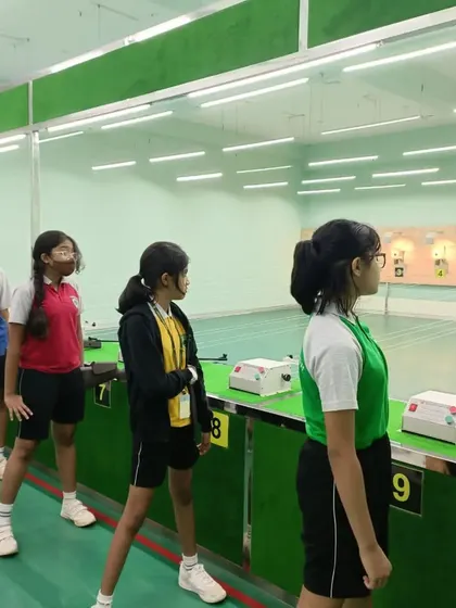 Students from Greenwoods High International School observing the range. We teach them the rules, safety protocols, and the discipline of the sport before they even take their first shot.