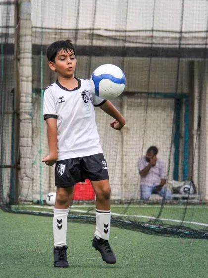 This player practices ball juggling, an excellent way to improve touch, balance, and overall comfort with the ball.