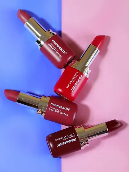 A slightly different angle of the four Mamaearth lipsticks on a pink and blue background, offering another option for a vibrant social media post.