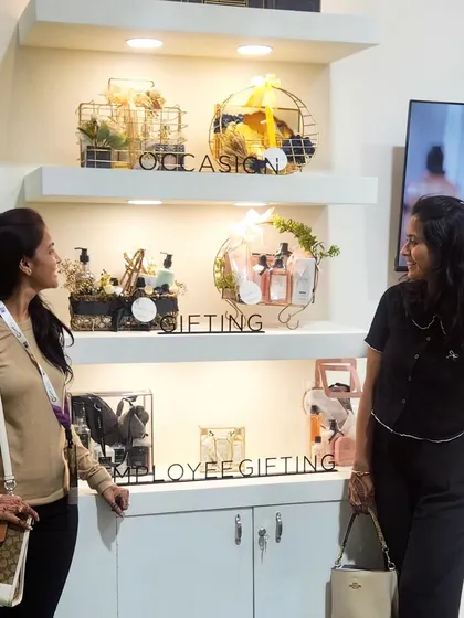 Here we are at the Gifts World Expo, standing by the display we created for Kimirica. This showcases our work in a real-world event setting, highlighting our services for occasion, gifting, and employee gifting.