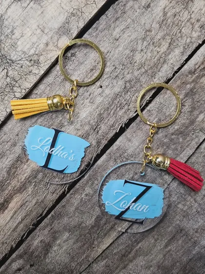 Duplicate of 43. These custom acrylic keychains add a pop of color and personality. I can create them with an initial and name, complete with a matching tassel.