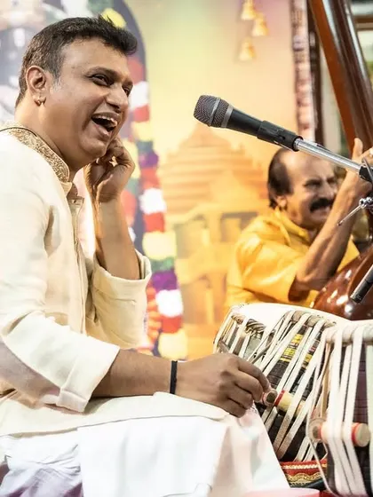 A close-up of Pramath Kiran on tabla during a traditional concert. His expressive playing is a joy to listen to and perform with.