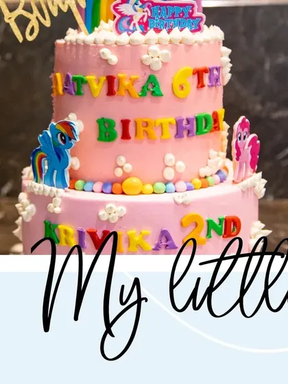 The two-tiered birthday cake for two sisters, decorated with their favorite 'My Little Pony' characters, Rainbow Dash and Pinkie Pie.