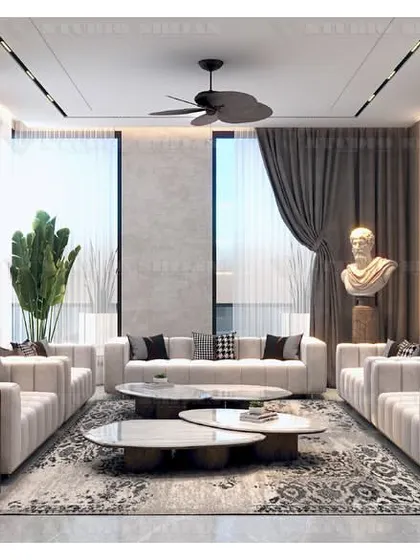 A full view of the Kirti Nagar drawing room, showing the spacious seating arrangement and large windows that flood the room with natural light.