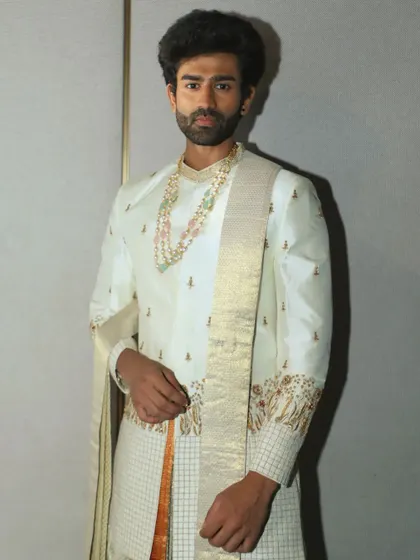 A portrait from my fashion week showcase. This outfit is based on traditional South Indian menswear, featuring a silk off-white and gold embroidered top that reflects a deep appreciation for our textile heritage.