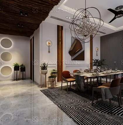The dining area in the Alameda project, featuring a stunning modern chandelier and a wall of backlit circular motifs.