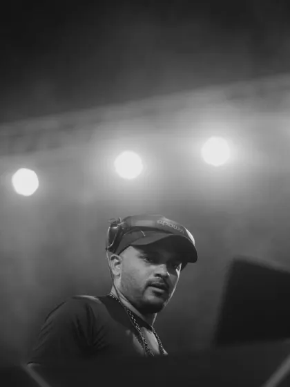 A powerful shot from behind the decks, with the stage lights creating a great silhouette. This is me in my element.