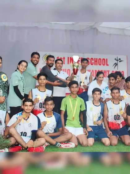 The U-19 boys' Kho-Kho team posing with their gold medals and trophy after winning the inter-school tournament.