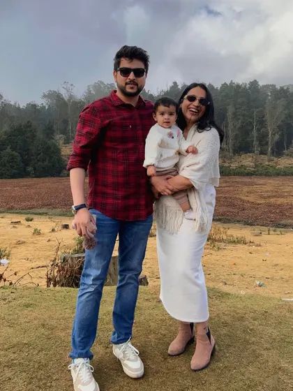 A classic family portrait from our trip to Ooty. This photo captures a happy, relaxed moment against a beautiful natural backdrop, perfect for content that feels both aspirational and achievable for young families.