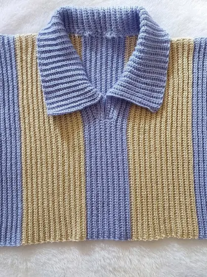 A flat-lay of the Knit-Like Sweater Vest, showcasing the clean lines and the beautiful texture of the stitch.