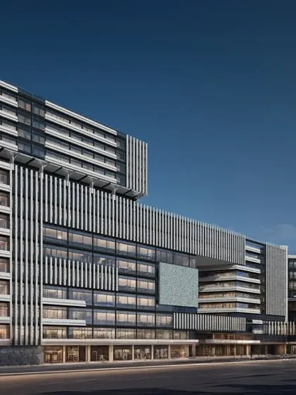 An evening render of the Vasai mixed-use development, highlighting the architectural form. A sky bridge connects the two main blocks, enhancing circulation and visual dynamism within the complex.