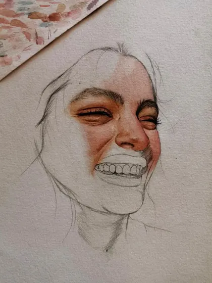 The final version of the mixed-media smiling portrait. The combination of detailed pencil work and splashes of color creates a really dynamic and emotional piece.