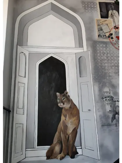 Another close-up of the Puma cat, highlighting the detail in the painting and its integration with the surrounding architectural elements.