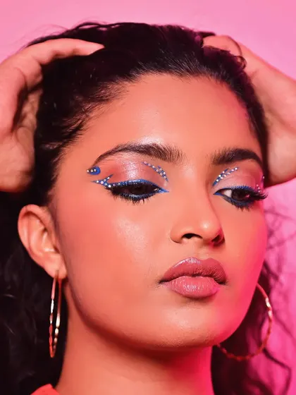 A close-up of this creative rhinestone look. I carefully placed each gem to create a sparkling, graphic design that catches the light and draws attention to the eyes.