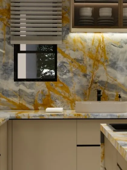 A close-up of the kitchen sink area, showcasing the rich patterns of the golden-hued Italian marble.