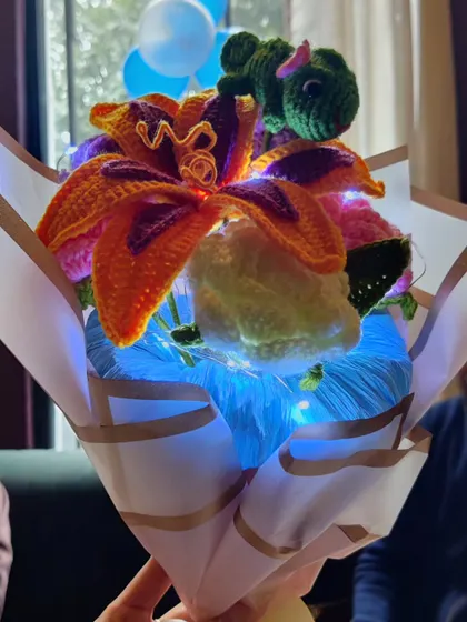 This custom Tangled-themed bouquet is a perfect example of how we can bring your favorite stories to life. It features Sundrop flowers, chamomile, and roses, all wrapped up with twinkling fairy lights for a truly magical gift.