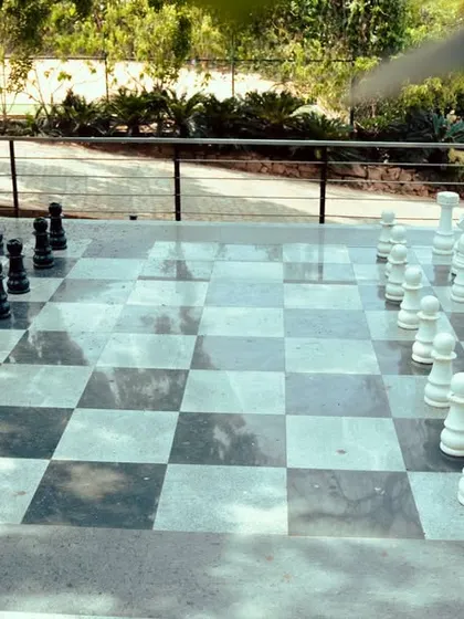 The giant chess set is a centerpiece of our outdoor games area, inviting guests to play and interact.