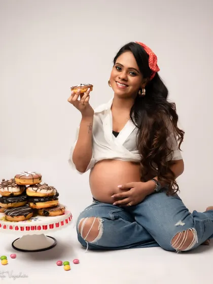 Let's be real, pregnancy comes with cravings. This is a reminder that your session is about you. If you want to celebrate with donuts, wear a sequin dress, or just be cozy, we will make it happen. It's about capturing your real, beautiful, and sometimes funny moments.