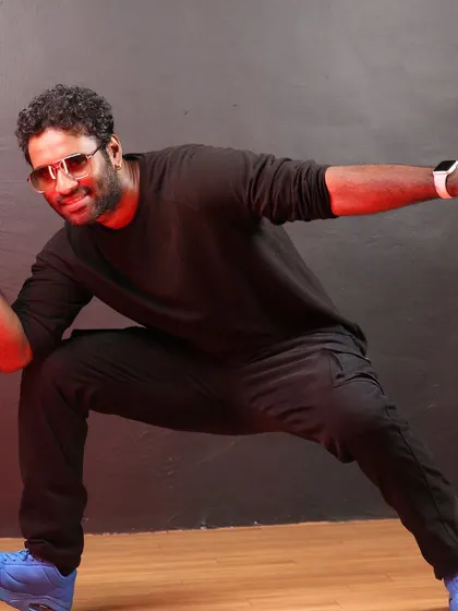 Striking a powerful pose. This image reflects the dynamic energy and strong foundation of our choreography style.
