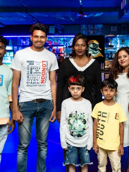 A large family group with kids posing for a photo. My space is suitable for family gatherings of all sizes.