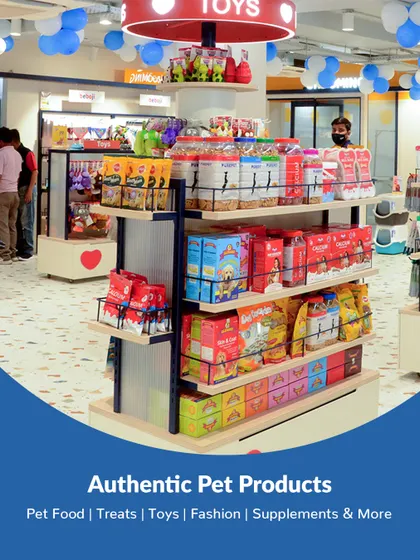 A display of authentic pet products at our Vastrapur, Ahmedabad center, featuring food, treats, toys, and fashion accessories.