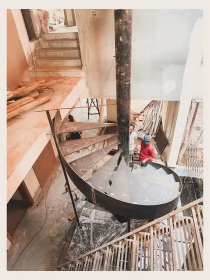 A spiral staircase for the "Waterfall" project being assembled on site, a sculptural object designed to be viewed and appreciated from a distance.
