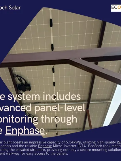 A view from underneath an elevated solar structure, showing the clean wiring and Enphase microinverters. This system includes advanced panel-level monitoring, allowing the homeowner to track the performance of each solar panel in real-time.