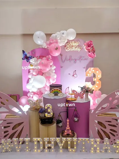 The full setup for the pink butterfly 3rd birthday party.
