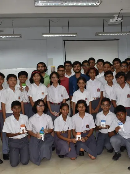 A group photo of students from a Guwahati school proudly displaying the small projects they created during our introductory workshop on circuits.
